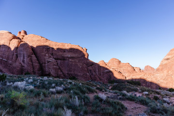 Fototapeta na wymiar Shadow across a red rock formation