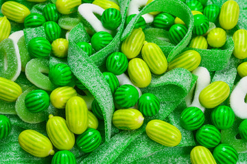 Assorted green gummy candies background. Top view. Jelly  sweets.