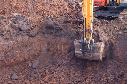  A Crawler Excavator Bucket Carries Out Earthwork At A Construction Site.