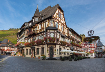 Naklejka na ściany i meble Bacharch, Germany, 09.20.2019, Half-timbered buildings in the old town of Bacharch. Rhine Valley