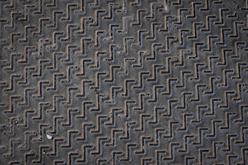 metal texture pattern, ribbed cast iron surface, textured black background , wall for dark backdrop , loft style interior.