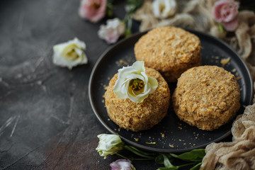 Three sponge cakes on a gray plate