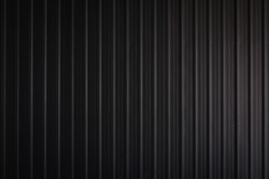 metal texture pattern, ribbed cast iron surface, textured black background , wall for dark backdrop , loft style interior.High Resolution horizontal  