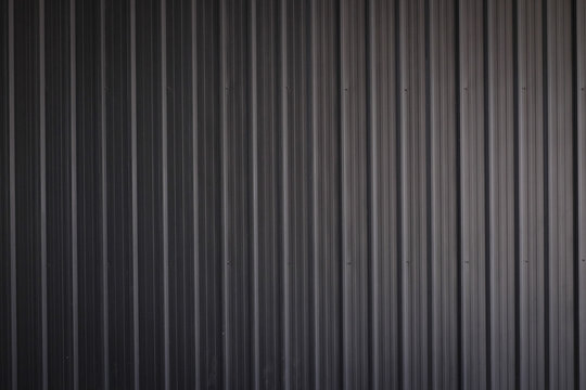 metal texture pattern, ribbed cast iron surface, textured black background , wall for dark backdrop , loft style interior.