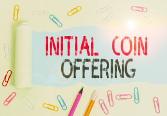 Conceptual hand writing showing Initial Coin Offering. Concept meaning crowdfunding using cryptocurrencies raising capital