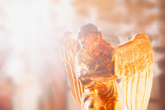 Ancient Statue Of Gold Angel In The Sunlight. Religion, Faith, Resurrection Concept