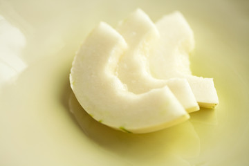 Sliced Variegated Snow Leopard Honeydew Melon aka Ivory Gaya or Sweet Snowball