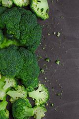 Raw broccoli on black chalkboard.Vegetables for diet and healthy eating.Free healthy vegetarian and vegan recipes.  Background with free text space.