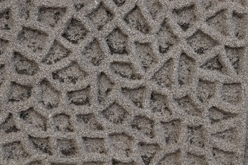 corrugated rough surface of brown color with traces of black earth
