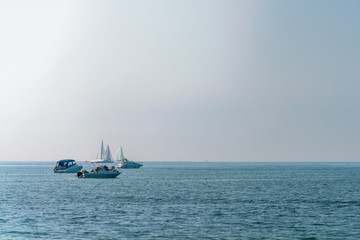 Sailboats and ships on the ocean