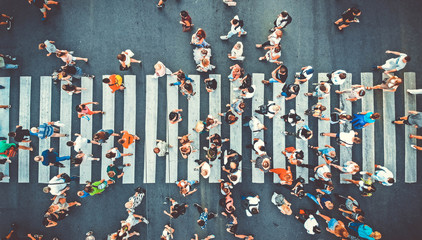 Aerial. People crowd on pedestrian crosswalk. Top view background. Toned image. - obrazy, fototapety, plakaty