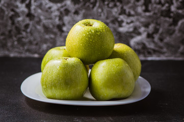 Fresh yellow apples on the table, water droplets. Texture of apples. Sliced than knives.