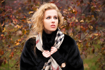 Portrait of beautiful young blonde woman in neckerchief