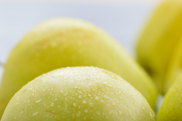 Apples closeup. Texture of apples, water droplets.