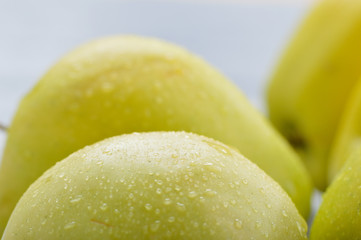 Apples closeup. Texture of apples, water droplets.