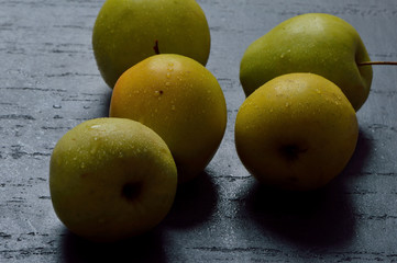 Fresh yellow apples. Wash apples in water.