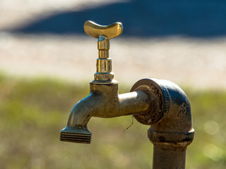 old chrome tap, with selective focus.