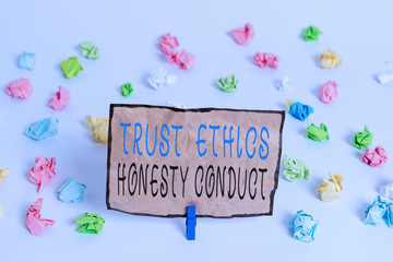 Text sign showing Trust Ethics Honesty Conduct. Business photo text connotes positive and virtuous attributes Colored crumpled papers empty reminder white floor background clothespin