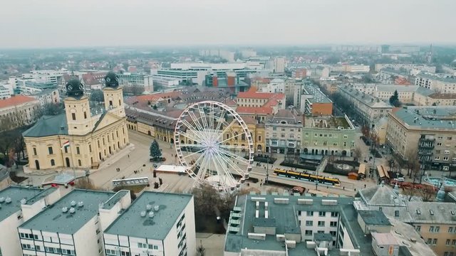 Aerial dolly forward shot, showing the historic city of Debrecen, Hungary. Old town with architecture, church and skyscrapers.