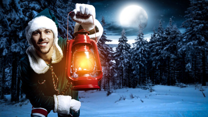 Young elf with red lamp and magic christmas night. 