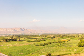 Fototapeta na wymiar Western Asia,Eurasia,South Caucasus, Republic of Armenia. Ararat Province. Ararat Valley. Lusarat. View of agricultural fields from the Khor Virap Monastery.