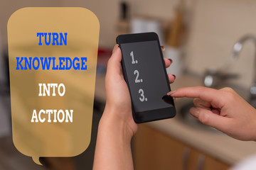 Writing note showing Turn Knowledge Into Action. Business concept for Apply what you have learned Leadership strategies woman using smartphone and technological devices inside the home