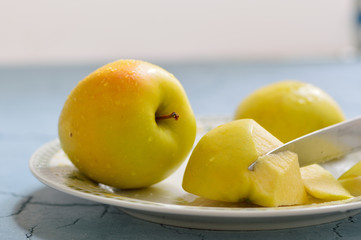 Apples in a plate. Cut apples. Fresh juicy apples.