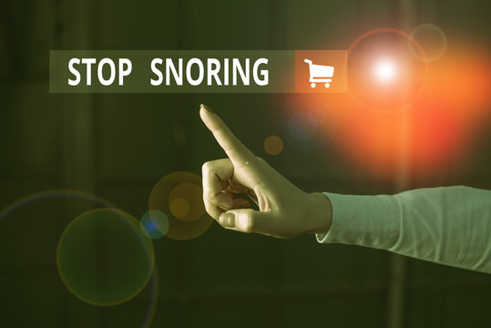 Word writing text Stop Snoring. Business photo showcasing noisy breathing during sleep due to vibrating airway tissue Finger pointing in the Dark with hand pointing in the copy space