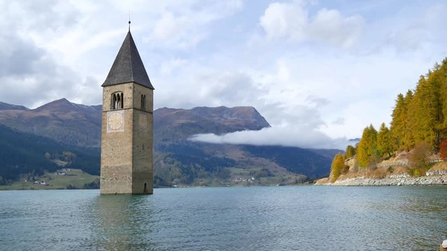 Curon bell tower emerges from the lake Resia - South Tyrol (Italy)