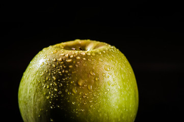 Apples in water, drops, splashes.