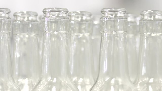 clean glass bottles factory lined up