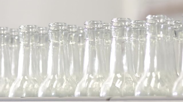 clean glass bottles factory lined up