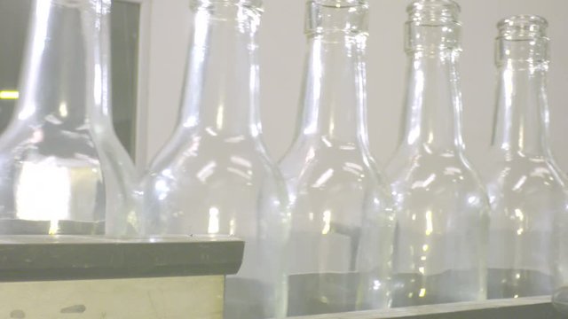 clean glass bottles factory lined up