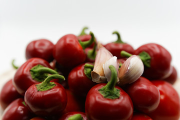 Close-up of beautiful red hot chili peppers with fresh pieces of garlic. Hot spices for food, vegetable spicy eating concept