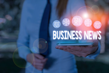 Conceptual hand writing showing Business News. Concept meaning Commercial Notice Trade Report Market Update Corporate Insight Woman wear work suit presenting presentation smart device