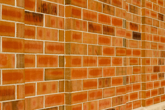 Orange color brick wall texture with 1/3 offset stagger brickwork pattern