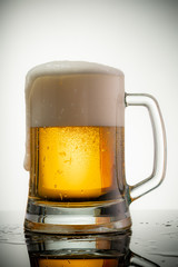 glass of beer with foam