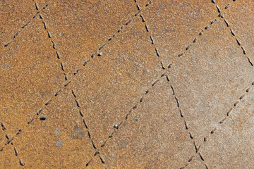 Sheet of rusty metal with rhombuses