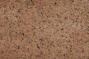 Brown wool texture background. Natural woolen surface with multicolored threads. Backdrop with free space. Coat, carpet, plaid or element of interior.