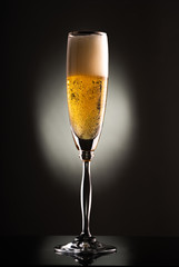 glass of champagne in the dark