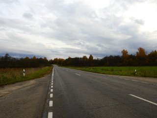 Autumn road empty stretching to horizon landscape
