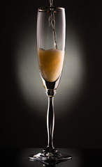 glass of champagne in the dark