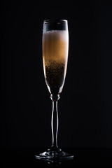 glass of champagne in the dark