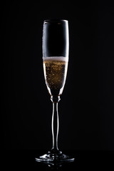 glass of champagne in the dark