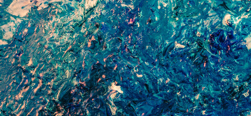 Smeared blue acrylic paint. Ocean surface effect. Decorative abstract art background.