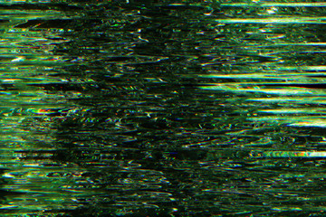 Video damage. Signal error. Green pixel vibration pattern overlay.