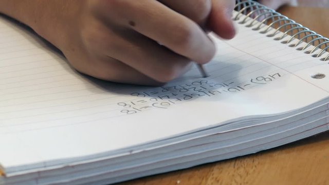 4K: Teen Girl Doing Algebra Homework