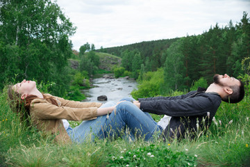 The woman and the man hold hands.
