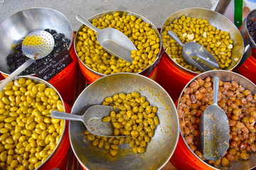 Green, brown and black marinated organic Mediterranean olives for sale on the local French market....
