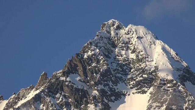 Telephoto shot of Austria's highest mountain, the Grossglockner as seen from the south with beautiful evening light lighting the main peak.